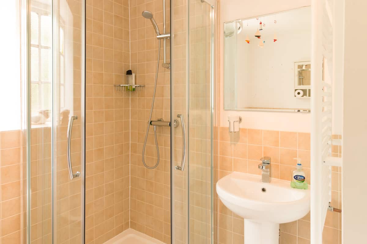 Bathroom with bath and separate shower at Apple Cottage, Dorset